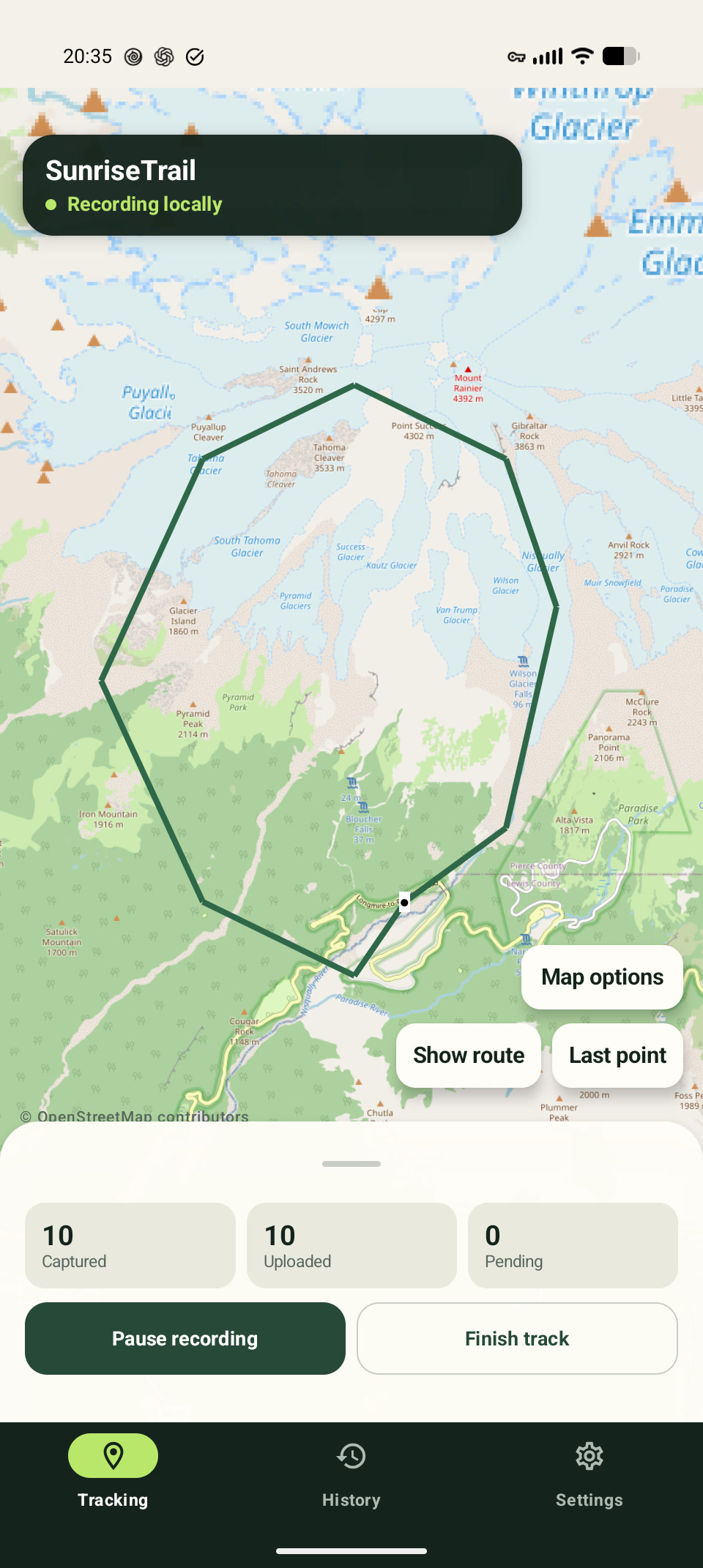 Android Backcountry Tracker screen showing the fictional SunriseTrail demo route near Mount Rainier, recording locally with ten captured and uploaded points and none pending.
